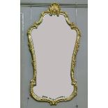 A reproduction gold painted mirror in George III style with shell cresting and hatched foliate