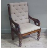 A Victorian mahogany framed armchair with buttoned back and drop in seat upholstered in oatmeal