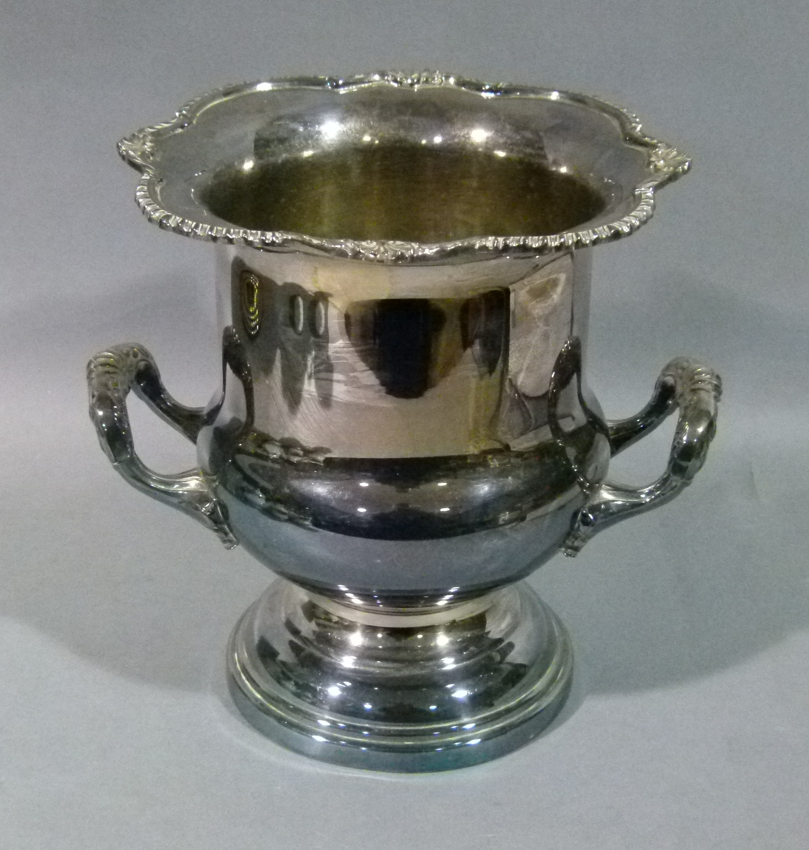 A Viners silver plated two handled champagne bucket in George III style with shell and gadroon