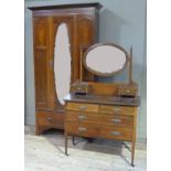 An Edwardian mahogany and satinwood inlaid wardrobe having a mirrored single door and drawer below