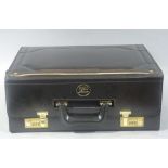 An R&D Associates black case with lacquered brass locks