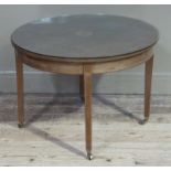 An Edwardian mahogany occasional table of circular outline, inlaid in satinwood with a fan paterae