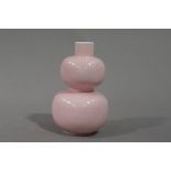 A reproduction pink glazed porcelain double gourd shaped vase, 11.5cm high, character mark in