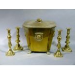 A brass coal vase and cover with lion mask ring handles and paw feet, together with a pair of