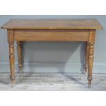 A Victorian rectangular table on turned satinwood legs