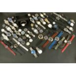 A collection of approximately 49 gentlemen's wristwatches and watch leads, all with quartz