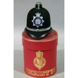 A Christy's miniature West Yorkshire police helmet contained in a red card box with gilt decoration,
