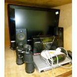 A flat screen television by Goodmans, a pair of Logitek speakers, pair of binoculars, Roberts radio,