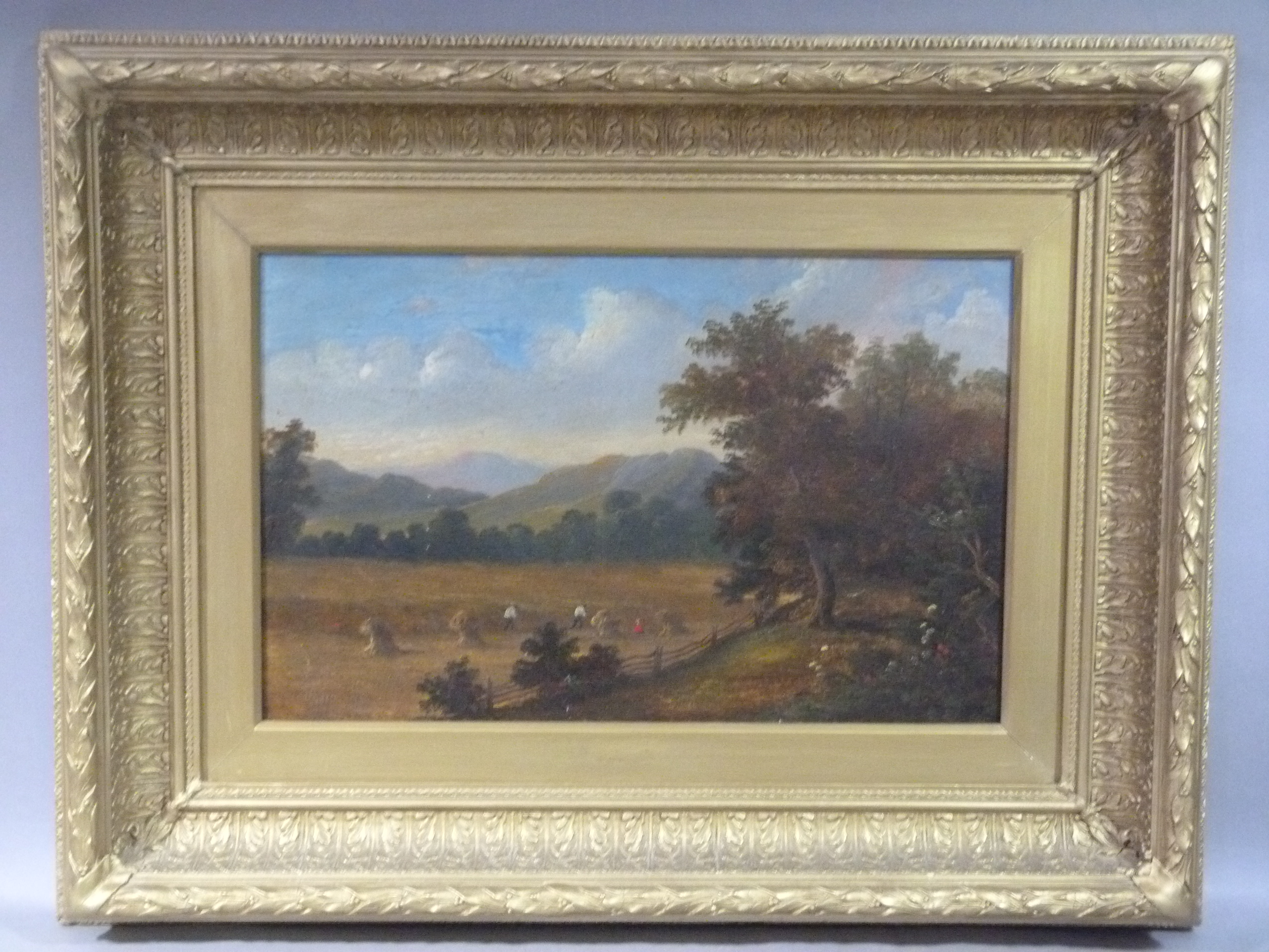 A 19th century harvest scene under blue skies, oil on canvas, unsigned