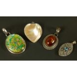 Four silver pendants including a heart shaped Mabe pearl set pendant, a baltic amber pendant