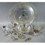 A silver plated circular two handled tray, cake basket of pierced design with swing handle, cup,