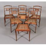 A set of six George IV mahogany and ebony inlaid dining chairs, each having a rope twist top rail,