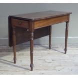 A 19th century mahogany single drop leaf table with drawer to the apron and on turned legs