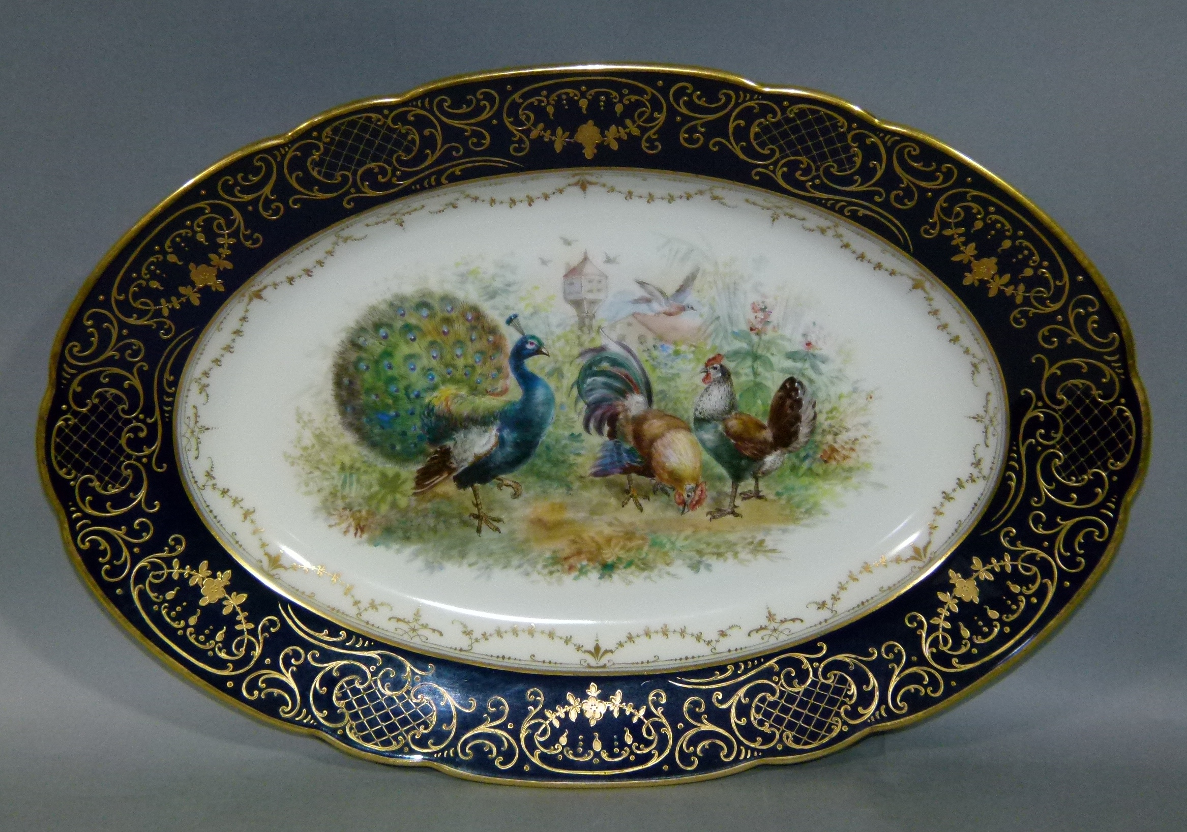 A Dresden porcelain oval meat platter, the centre painted with chickens, cockerel and peacock with - Image 2 of 2