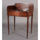 A George IV mahogany bow fronted washstand having a three quarter gallery above a surface with