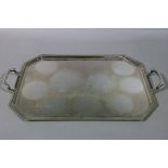 A silver plated two handled tray of canted rectangular form, 54cm wide