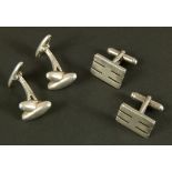 A pair of silver cufflinks by S J Dupont, Paris, together with a pair of silver cufflinks each