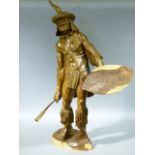 A hand carved Tamboti figure of a Zulu warrior by J.Dava, 90cm high