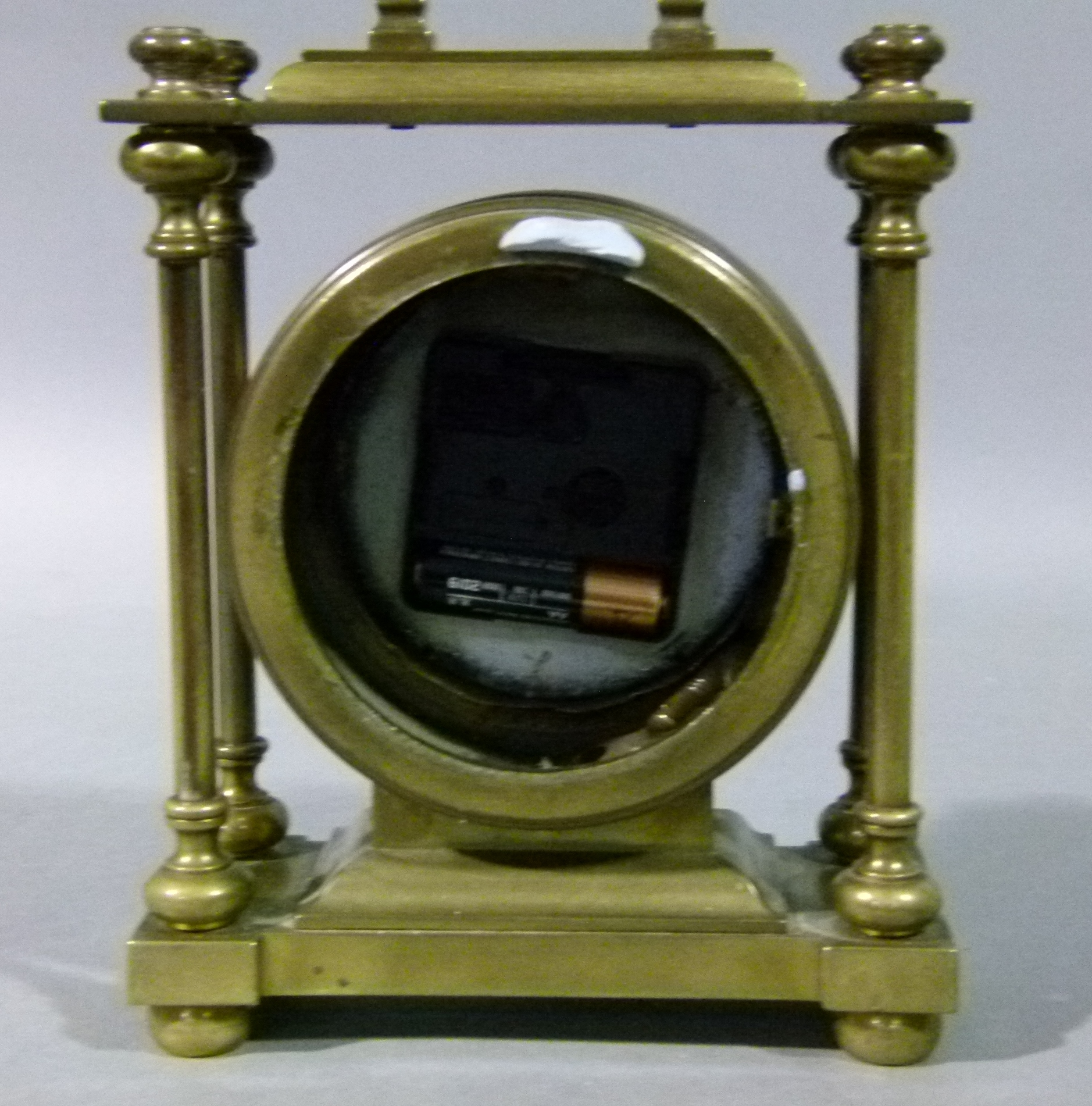 A brass cased mantel clock with fixed carrying handle, the circular drum case contained within - Image 2 of 2