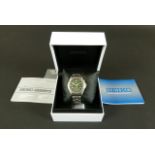 Seiko gentleman's kinetic day and date wristwatch in stainless steel case No 810153, green dial with