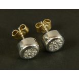 A pair of diamond cluster ear studs in 9ct gold, the brilliant cut stones grain set within a domed