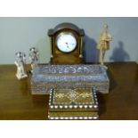 An Edwardian inlaid mahogany mantel clock, the brass bezel enclosing a circular dial with Arabic