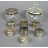 Seven silver napkin rings variously engraved in initials; together with two silver topped and