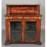 A George IV rosewood chiffonier, having a pierced brass three-quarter gallery to the shelf, raised