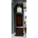 A 19th century mahogany and oak long case clock having a broken neck pediment with ball and spire