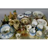Glass and china ornaments including, Hummel figure, tyg, cabinet cups, glass animals, vases, etc
