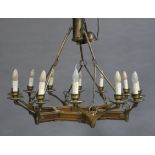A brass mounted wooden hexagonal chandelier with six branches each mounted with pair of lights,