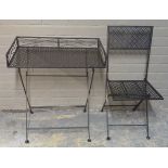 A metal folding table and garden chair