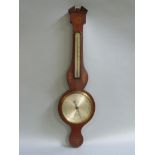 A 19th century mahogany inlaid barometer/ thermometer by Figerio of London inlaid in satin wood with