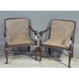 A pair of mahogany framed bergere caned open armchairs on cabriole legs
