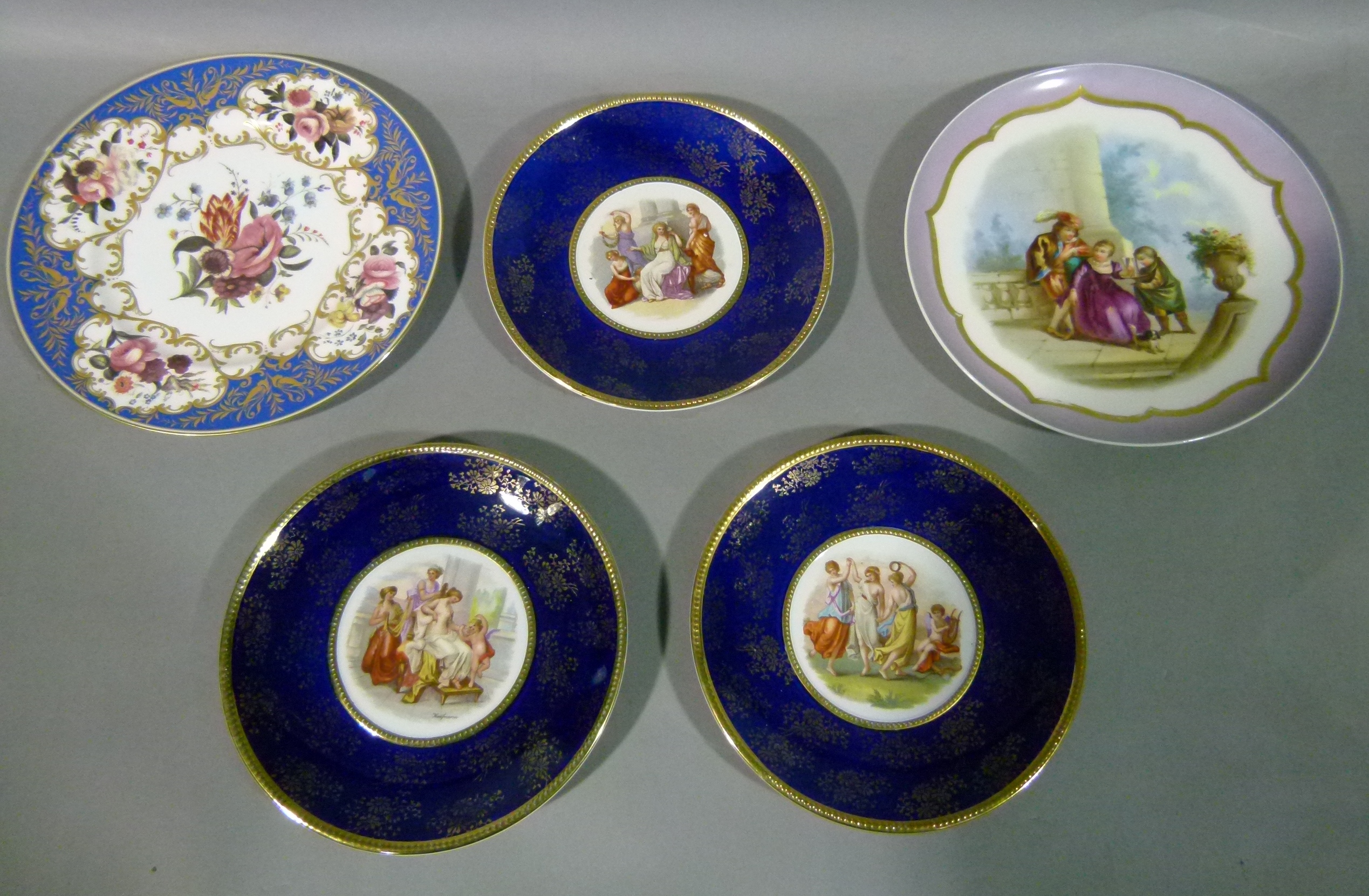 A Vienna style circular porcelain cabinet plate painted to the centre with a couple being served