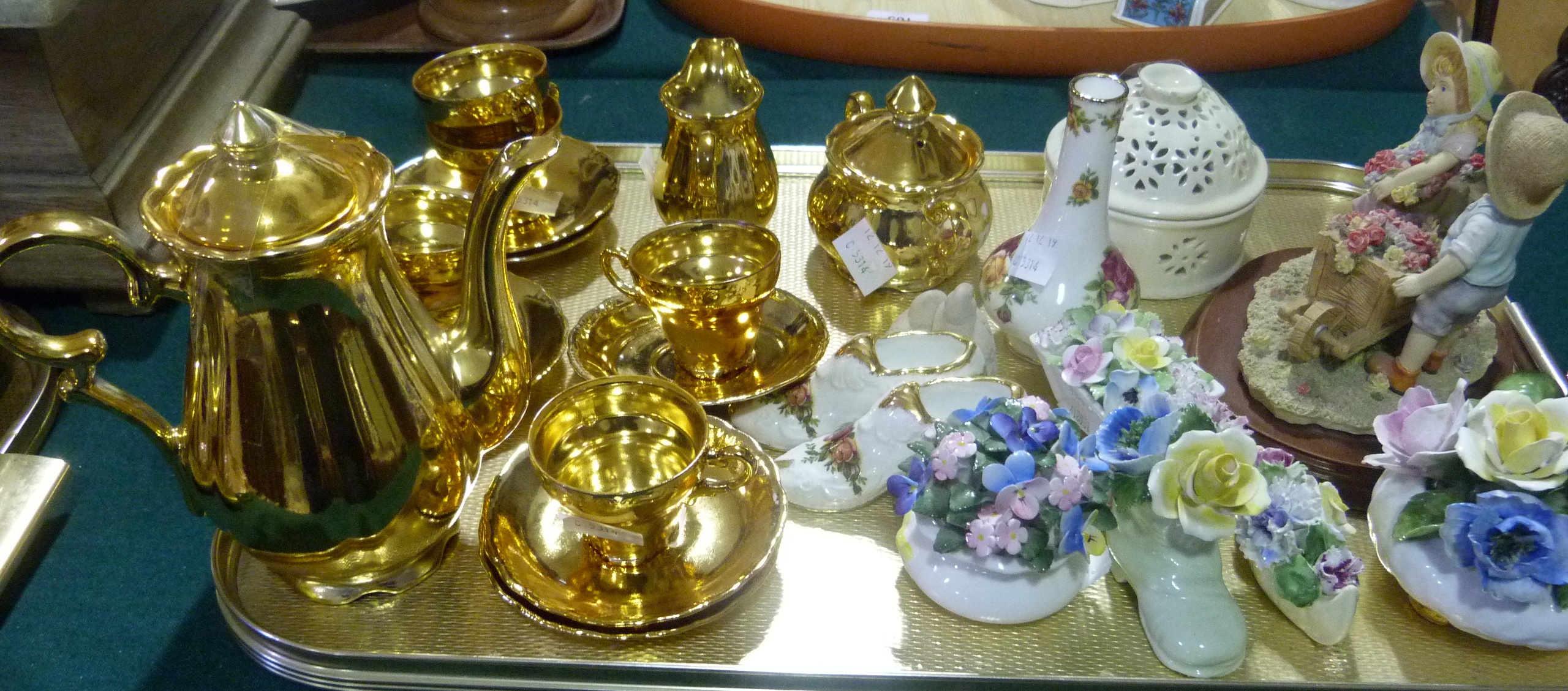 A gilt coffee service, flower clusters, resin figure group, Leeds creamware box and cover, etc