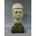 A reproduction cast Buddha head on square ebonised base, 54cm high overall