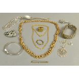 A collection of costume jewellery in white and yellow base metal including rings, pendants, a