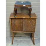 A 1950's oak veneer record cabinet on splayed legs, together with a foot stool on cabriole legs