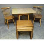 A nest of G Plan teak occasion tables of rectangular outline, together with a vintage formica drop