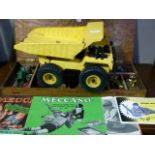 700 Series dumper truck together with a vintage Meccano boxed set