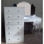 A cream painted dressing table of serpentine outline having triple mirrors, drawer to the centre and