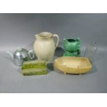 An Art Deco pottery and chrome teapot, a Sylvac pixie mushroom jug No 1969 in green glaze, a Boots