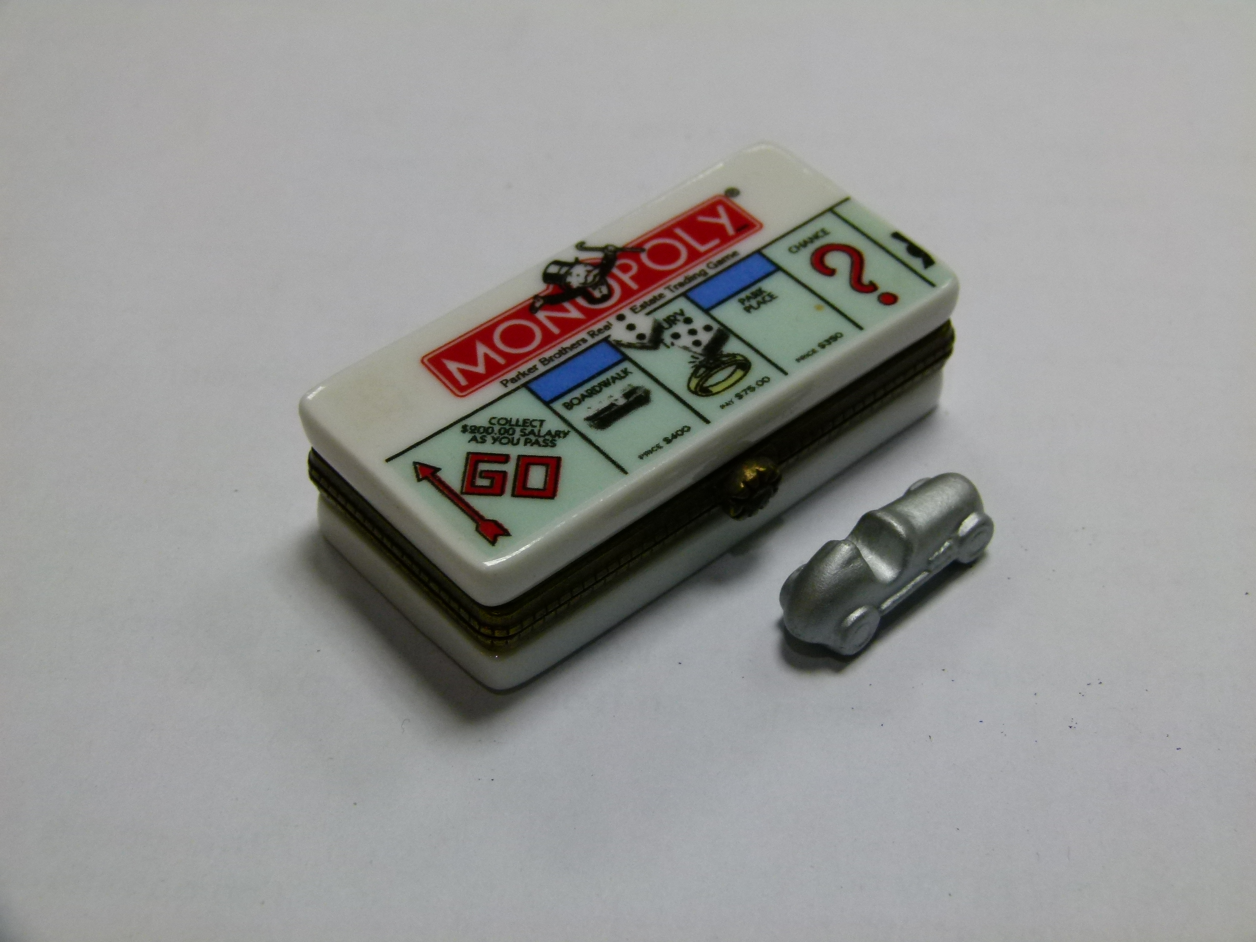 A Parker Brothers real estate trading game 'Monopoly' novelty pill box