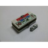 A Parker Brothers real estate trading game 'Monopoly' novelty pill box