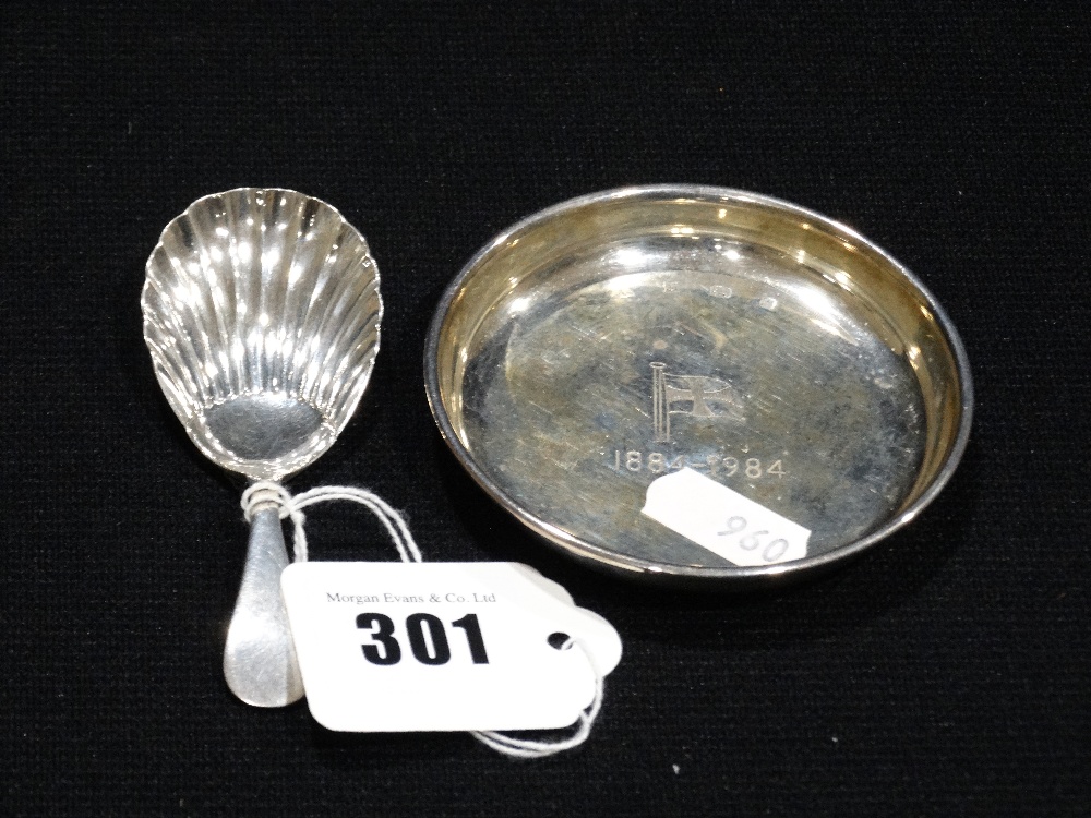 A Silver Caddy Spoon, Together With A Small Circular Silver Dish