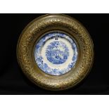 A Brass Framed Staffordshire Pottery Wall Plate, Eton College Pattern