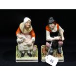 A Pair Of Staffordshire Pottery Cobbler Figures On Square Bases, (AF)