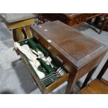 An Art Deco Period Two Drawer Cutlery Table Retaining Some Contents