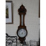 An Edwardian Oak Aneroid Wall Barometer